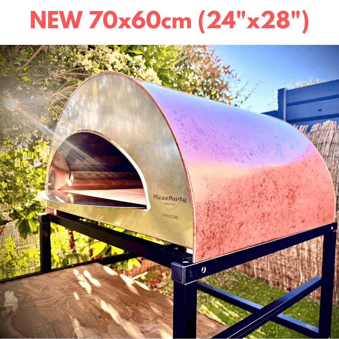 Overhead view of the Forno Pizza Party Grand Inspiration Antique Copper Oven with a Baking Stone Cooking Surface