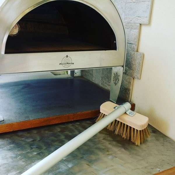 Close-up of brass bristles from the Pizza Party pizza oven brush