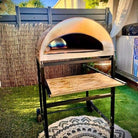 Black wheeled Pizza Party cart with Emozione oven and wooden terrace shelf